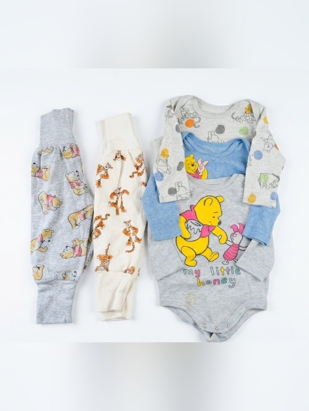bundle of Winnie the Pooh and friends baby clothes, perfect for your little hone